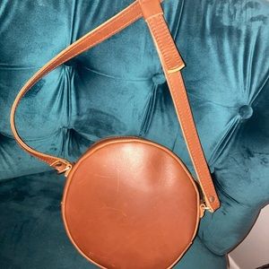Circular crossbody leather bag